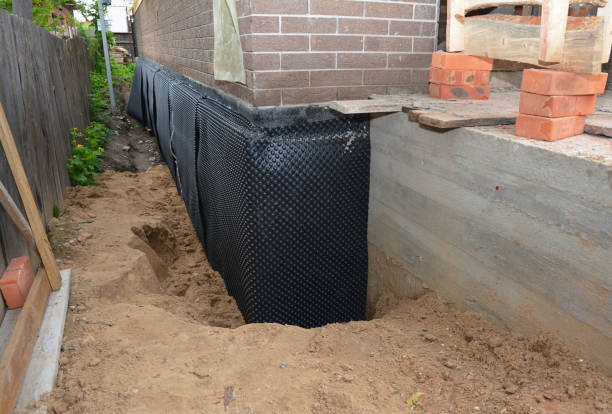 Happy homeowners after waterproofing job in Kingston